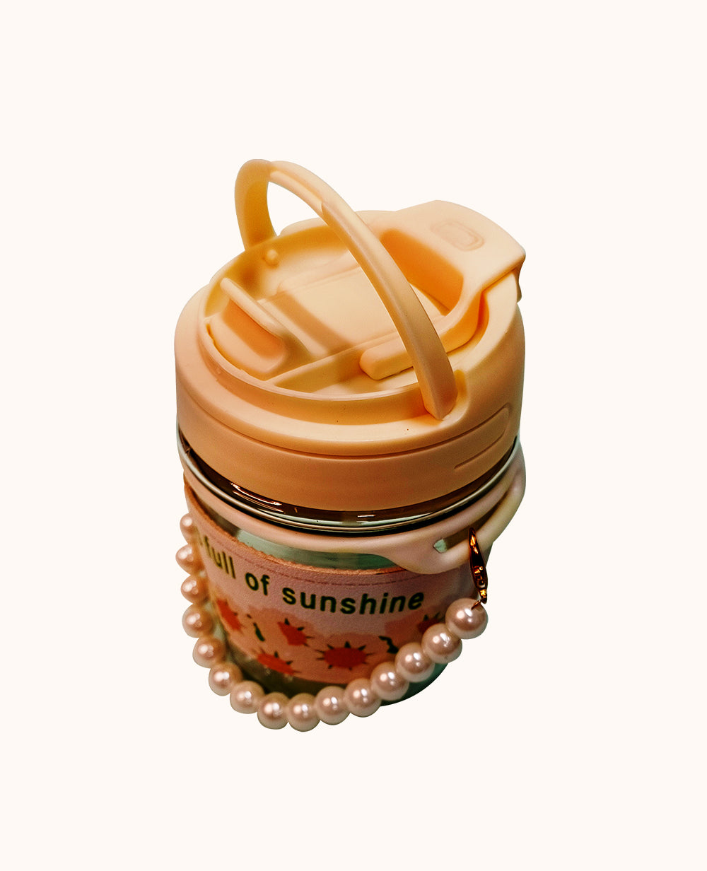 Stylish Coffee Mug with ChainStylish Coffee Mug with Tote Chain, Tulip Glass 350ml
Brighten your day with CeePoo’s Mini Glass Travel Mug, a chic and practical companion available in charming peaMugStylish Coffee Mug